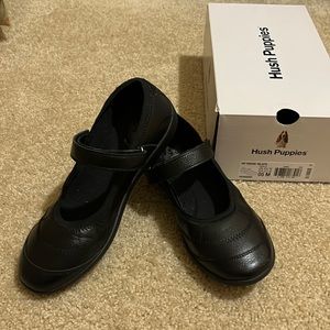 Black Mary Jane shoes.